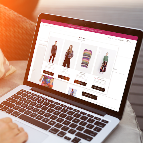 A macbook showing an ecommerce feature that allows the complete clothing look to be purchased in one go.